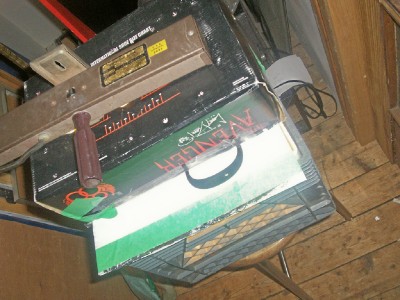Its made from a milk crate, shoe box, and a white plastic sign. Im a student what do u expect. 