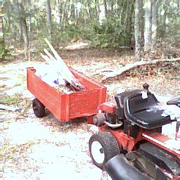 picture of the BONG BUGGY helping to  move cowshit tools potting soil mix plastic sheeting and  such  while getting plant beds ready for next growing season